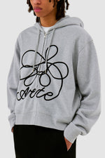 Sweat à capuche zippé avec logo fleuri